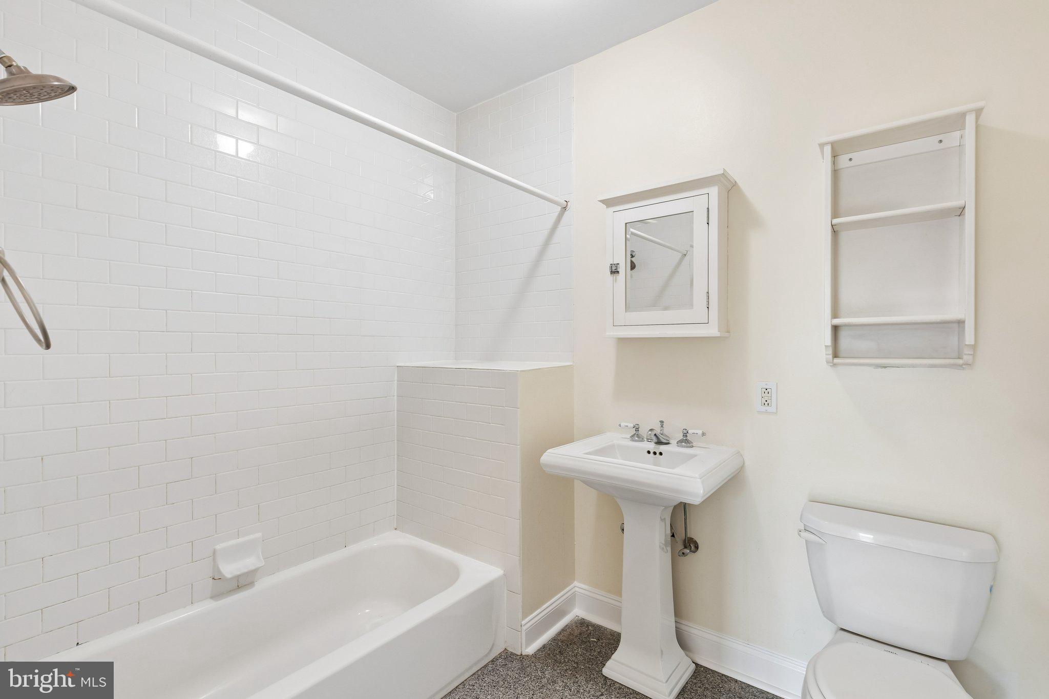 714 South 18th Street Philadelphia, PA 19146 - Photo 22 of 28 a bathroom with a sink a toilet and a bathtub