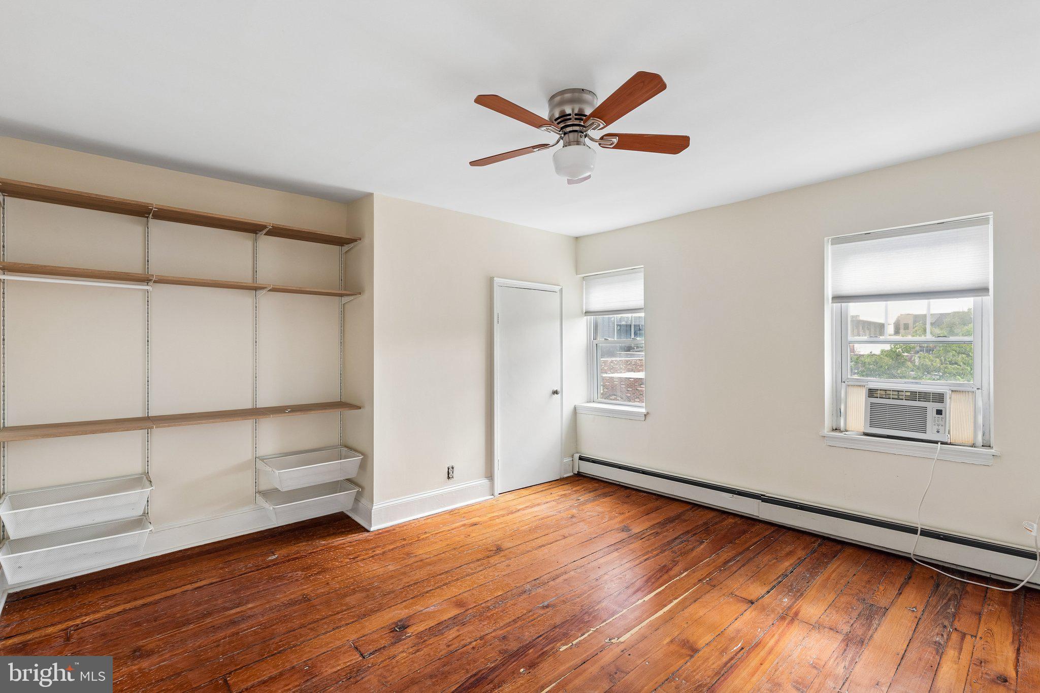 714 South 18th Street Philadelphia, PA 19146 - Photo 24 of 28 an empty room with wooden floor closet and windows