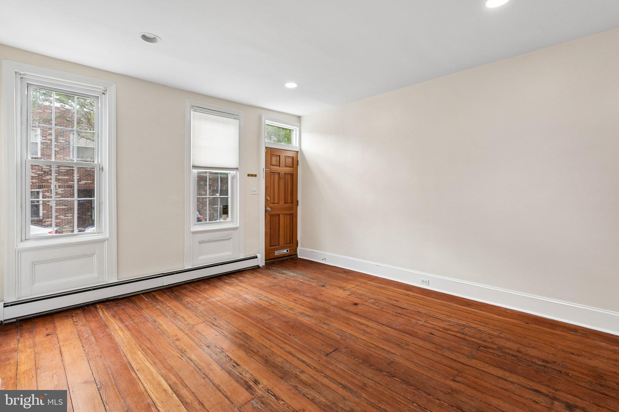 714 South 18th Street Philadelphia, PA 19146 - Photo 4 of 28 a view of an empty room with wooden floor and a window