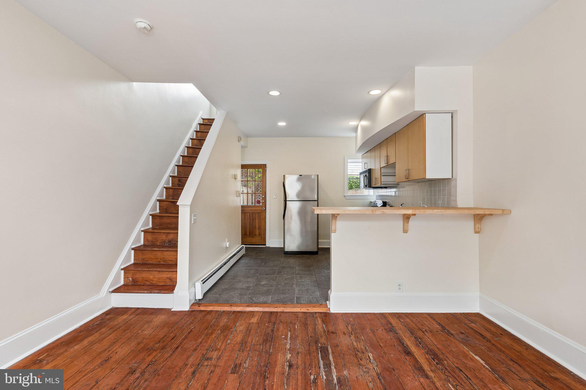 714 South 18th Street Philadelphia, PA 19146 - Photo 5 of 28 a view of a kitchen with wooden floor and electronic appliances