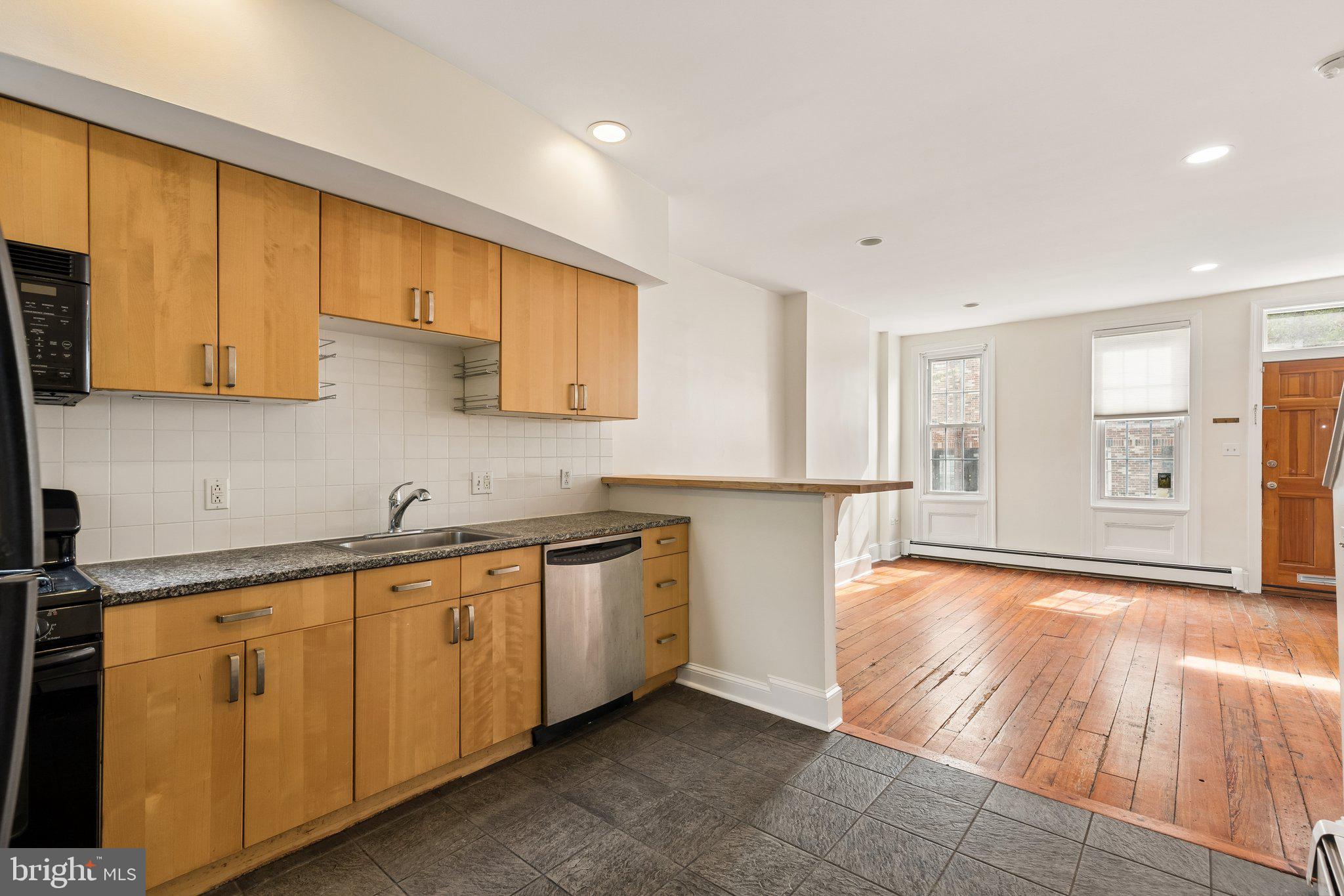 714 South 18th Street Philadelphia, PA 19146 - Photo 8 of 28 a view of a kitchen with wooden floor