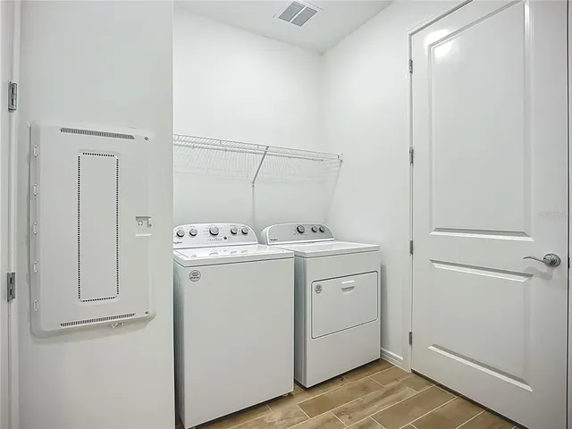 a utility room with dryer and washer