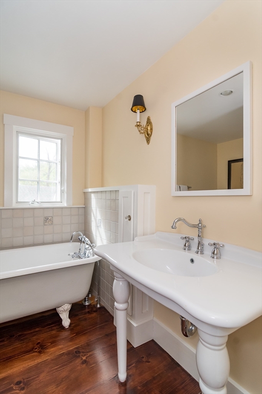 97 Maple Street Sherborn, MA 01770 - Photo 11 of 25 a bathroom with a sink and a mirror