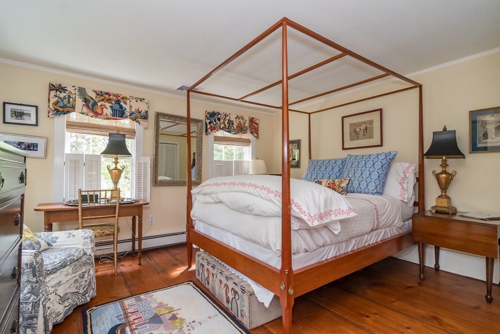 97 Maple Street Sherborn, MA 01770 - Photo 12 of 25 a bed sitting in a bedroom next to a window