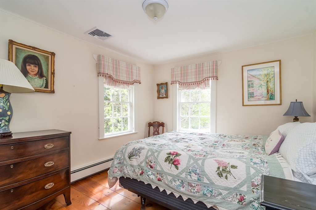 97 Maple Street Sherborn, MA 01770 - Photo 14 of 25 a bedroom with a bed and a window