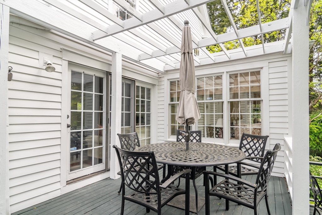 97 Maple Street Sherborn, MA 01770 - Photo 15 of 25 a view of a dining room with furniture and wooden floor