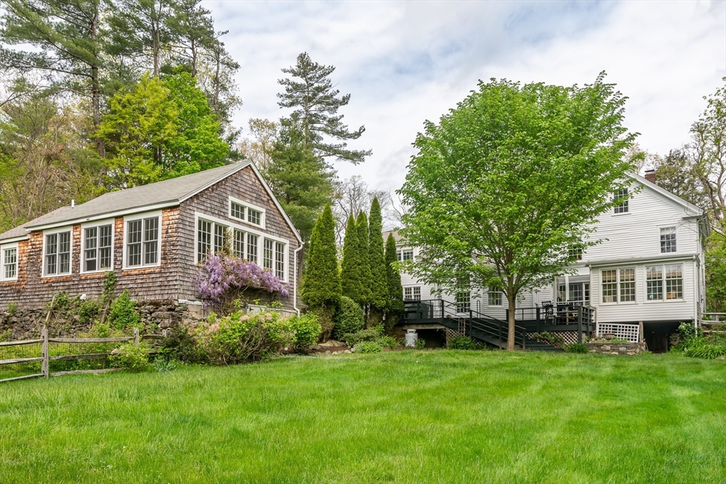 97 Maple Street Sherborn, MA 01770 - Photo 22 of 25 a view of a house with backyard and garden