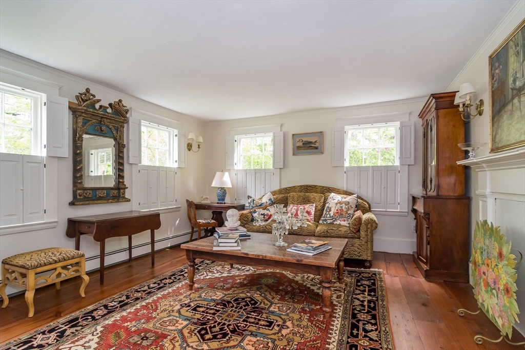 97 Maple Street Sherborn, MA 01770 - Photo 3 of 25 a living room with furniture a rug and a window