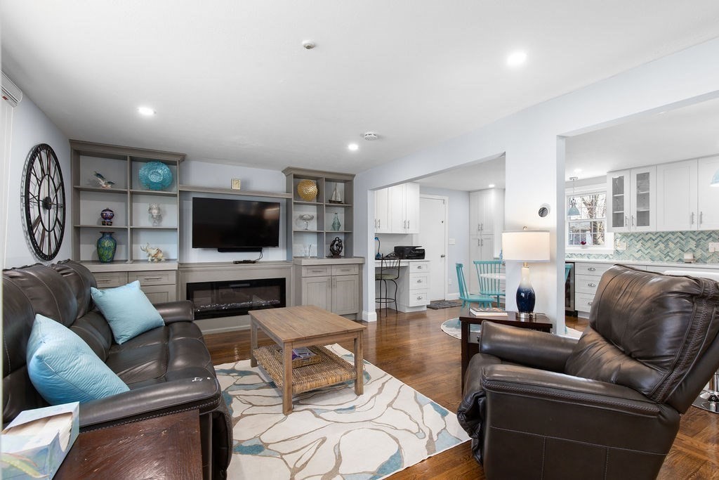 71 Pond Lane Randolph, MA 02368 - Photo 11 of 35 a living room with furniture and a flat screen tv
