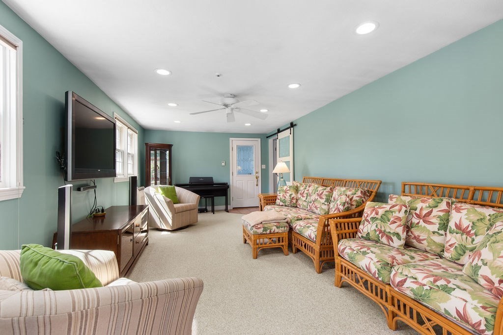 71 Pond Lane Randolph, MA 02368 - Photo 13 of 35 a living room with furniture and a flat screen tv