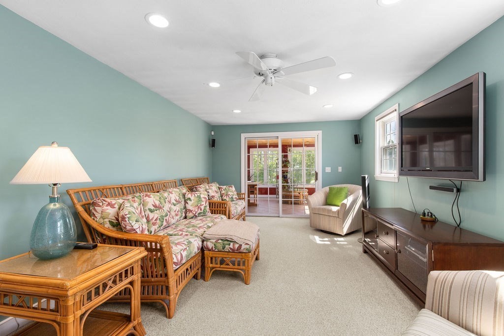 71 Pond Lane Randolph, MA 02368 - Photo 14 of 35 a living room with furniture and a flat screen tv
