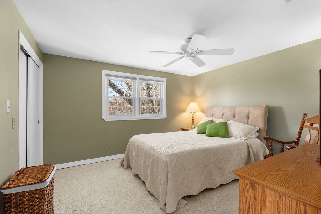 71 Pond Lane Randolph, MA 02368 - Photo 18 of 35 a bedroom with two beds and painting on the wall