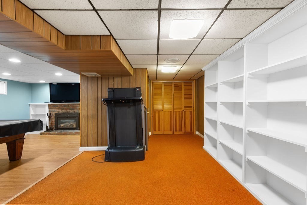 71 Pond Lane Randolph, MA 02368 - Photo 23 of 35 a view of a room with shelves