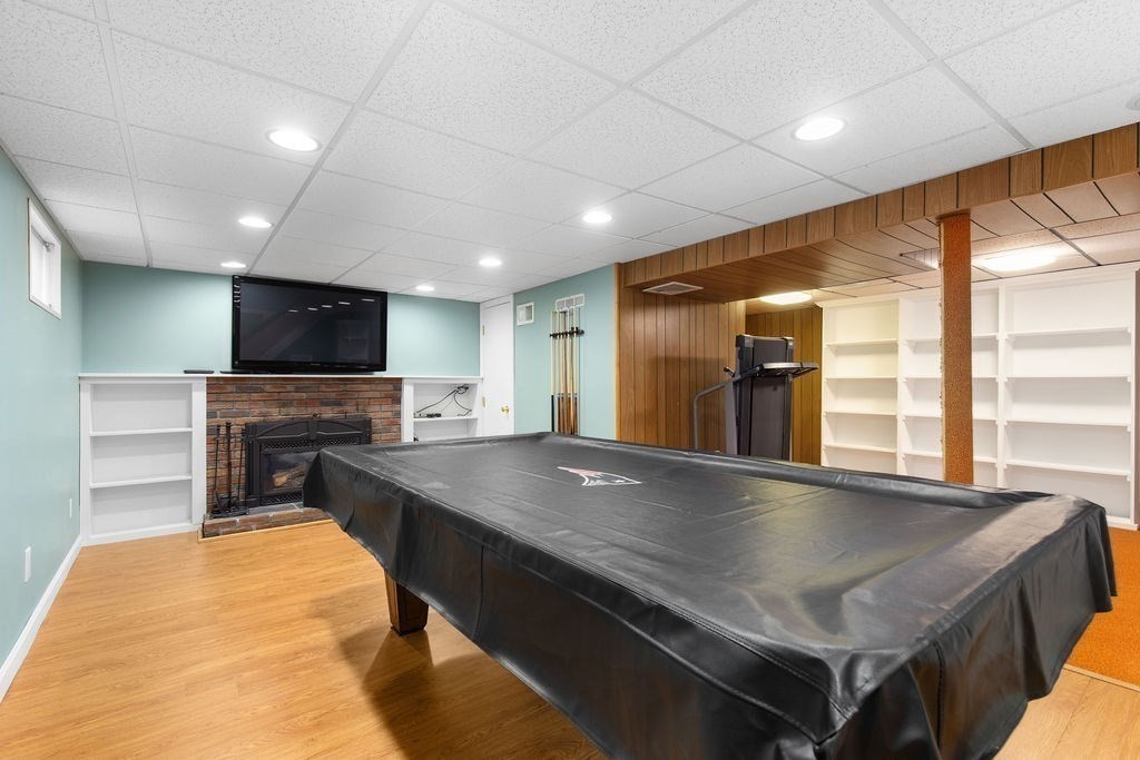 71 Pond Lane Randolph, MA 02368 - Photo 24 of 35 a kitchen with a table chairs sink and microwave