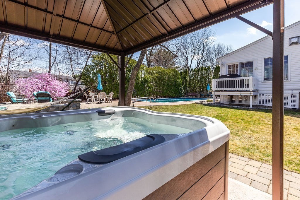 71 Pond Lane Randolph, MA 02368 - Photo 29 of 35 a view of a swimming pool with a patio