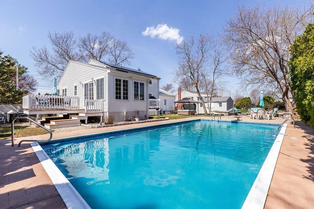 71 Pond Lane Randolph, MA 02368 - Photo 3 of 35 a view of a house with pool and chairs