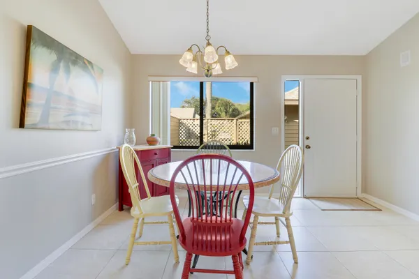 a view of a dining room with furniture window and outside view