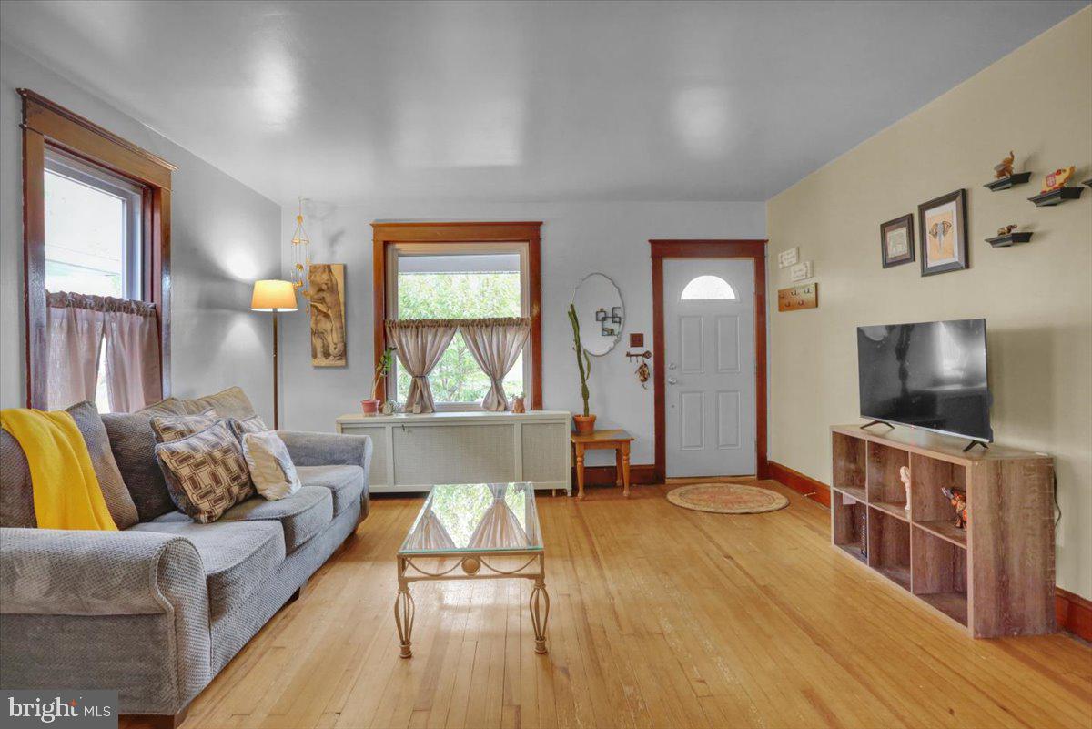 136 West Elm Street Reading, PA 19607 - Photo 5 of 23 a living room with furniture and a flat screen tv