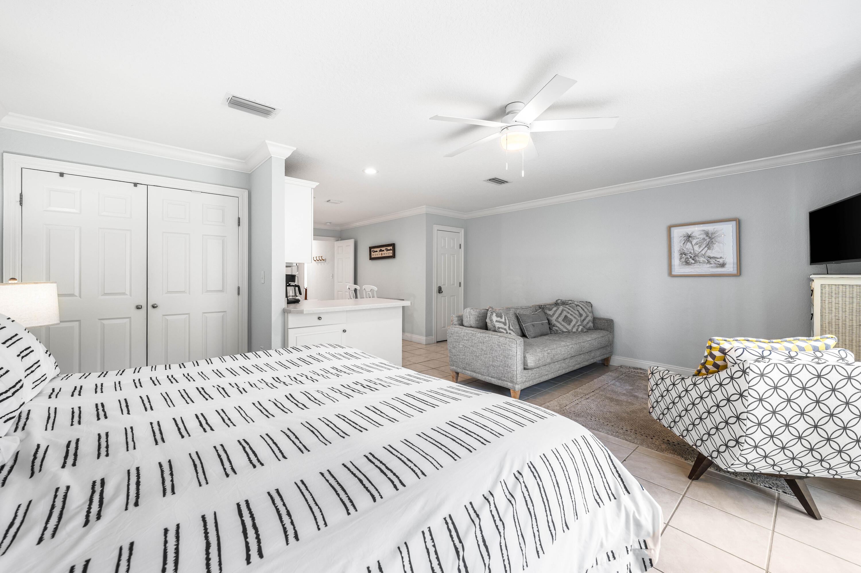 33 Dune Breeze Lane, Unit H2 Santa Rosa Beach, FL 32459 - Photo 39 of 54 a bedroom with a large bed and a chandelier
