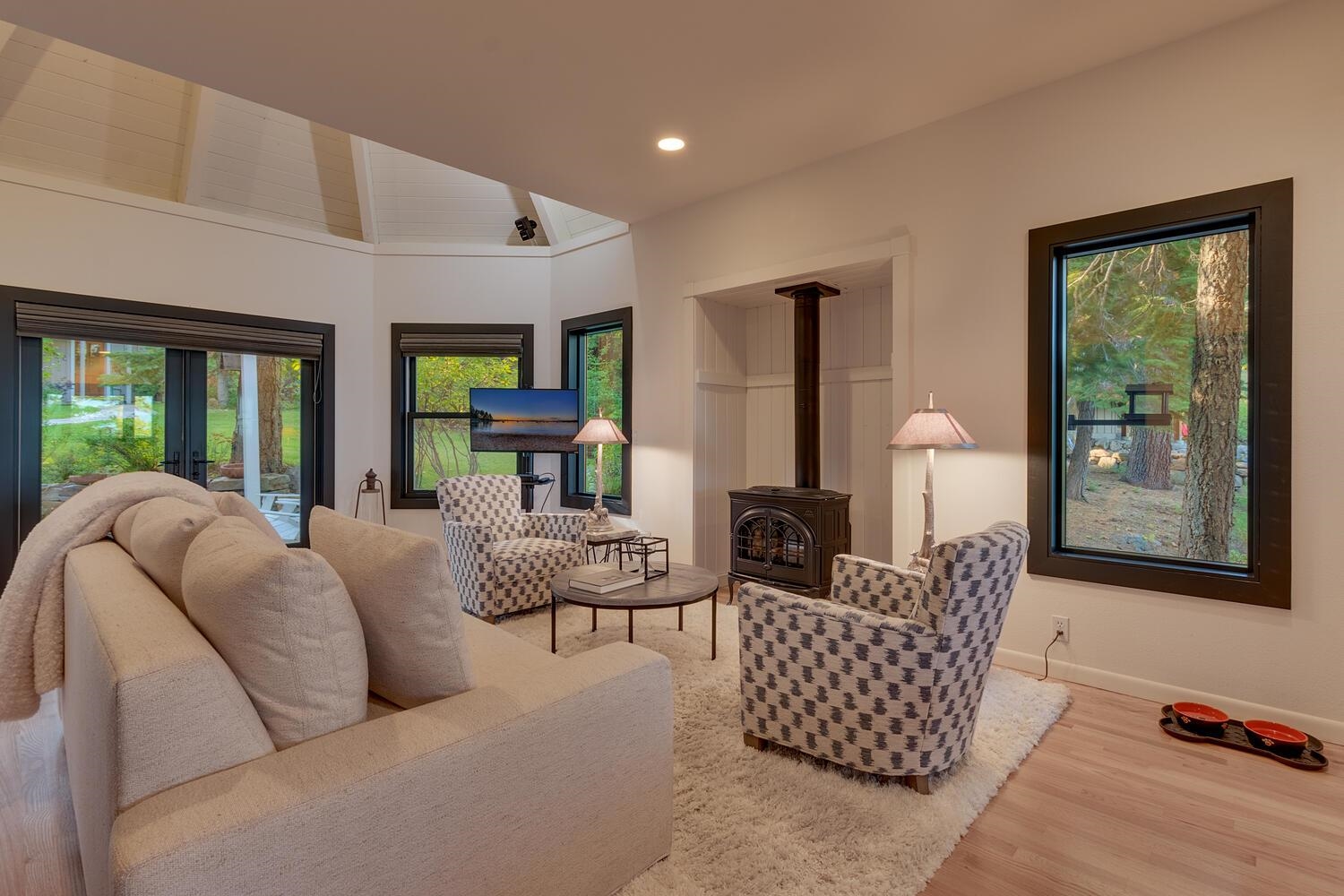 260 Old County Road Carnelian Bay, CA 96140 - Photo 11 of 28 a living room with furniture and a large window