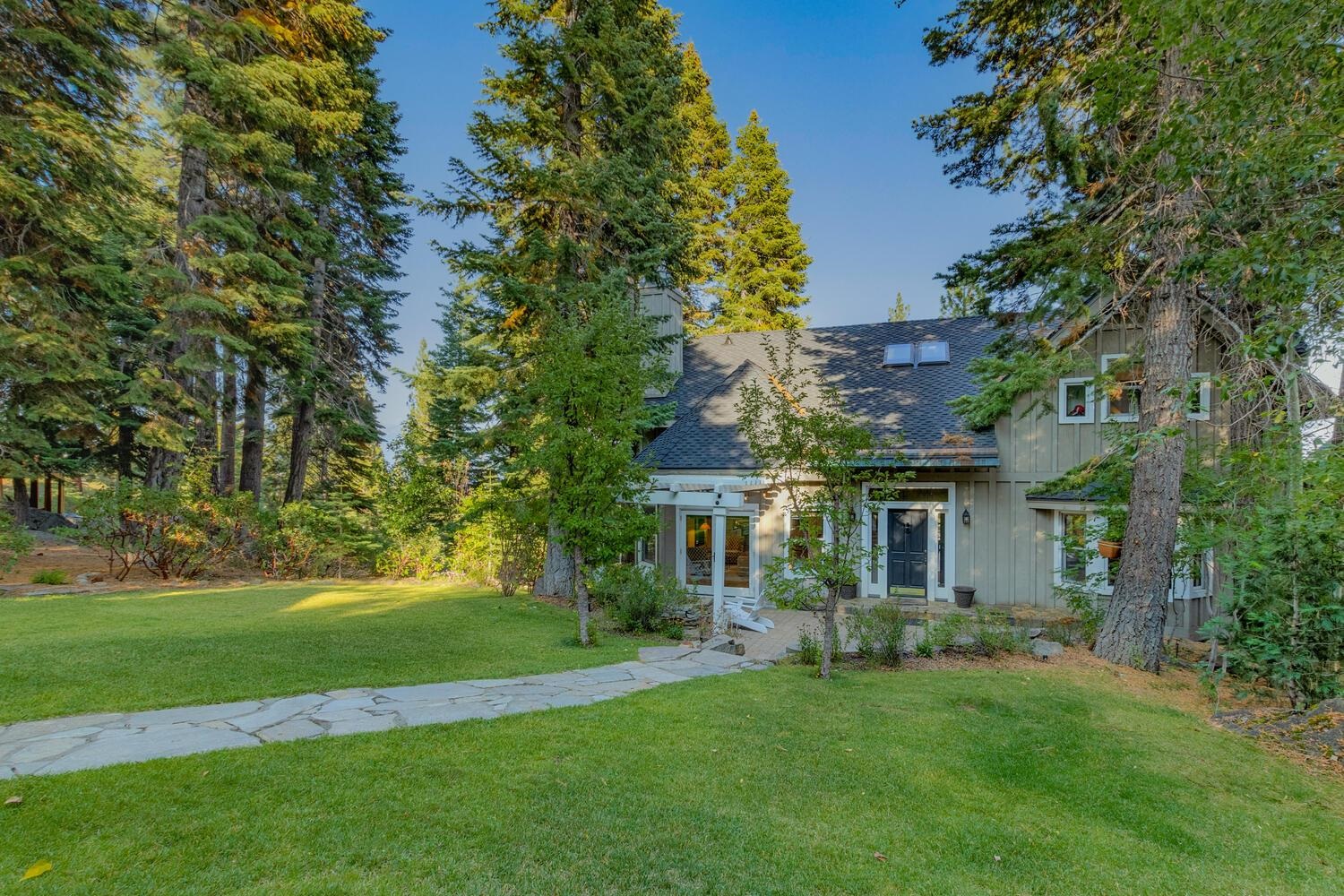 260 Old County Road Carnelian Bay, CA 96140 - Photo 2 of 28 a front view of a house with a yard