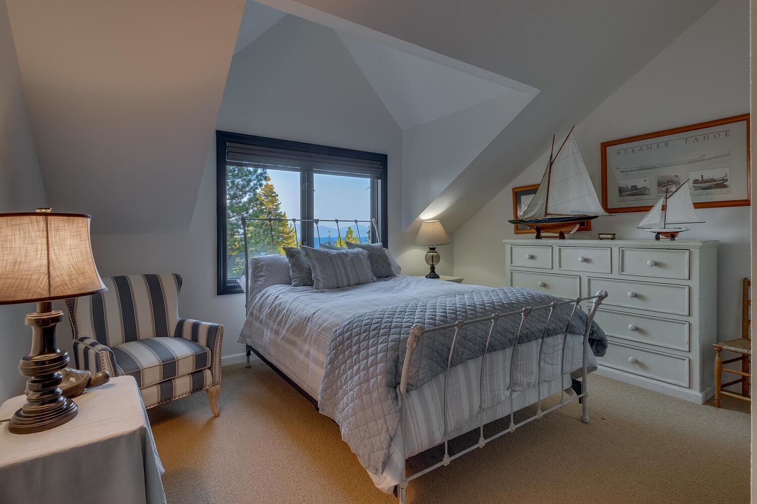 260 Old County Road Carnelian Bay, CA 96140 - Photo 26 of 28 a bedroom with a bed a flat screen tv and dresser