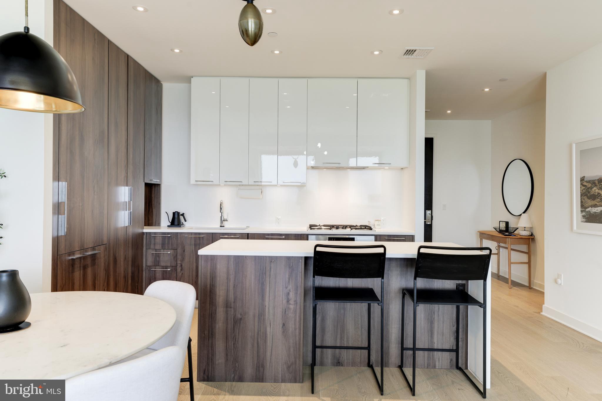1650 Silver Hill Drive, Unit 23091 McLean, VA 22102 - Photo 18 of 86 a kitchen with a table and chairs in it