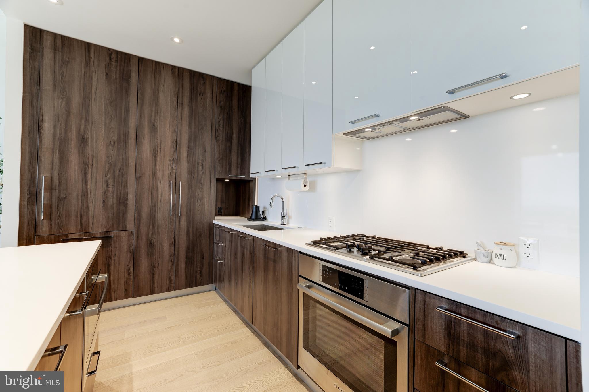 1650 Silver Hill Drive, Unit 23091 McLean, VA 22102 - Photo 21 of 86 a kitchen with granite countertop a stove and a sink