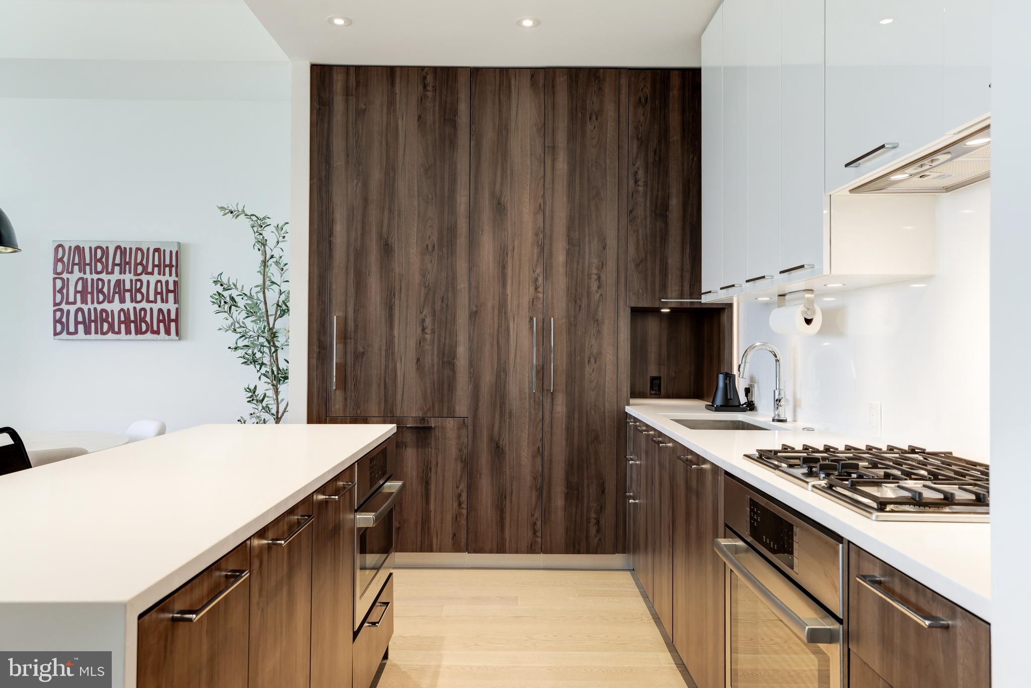 1650 Silver Hill Drive, Unit 23091 McLean, VA 22102 - Photo 22 of 86 a kitchen with a stove and a refrigerator