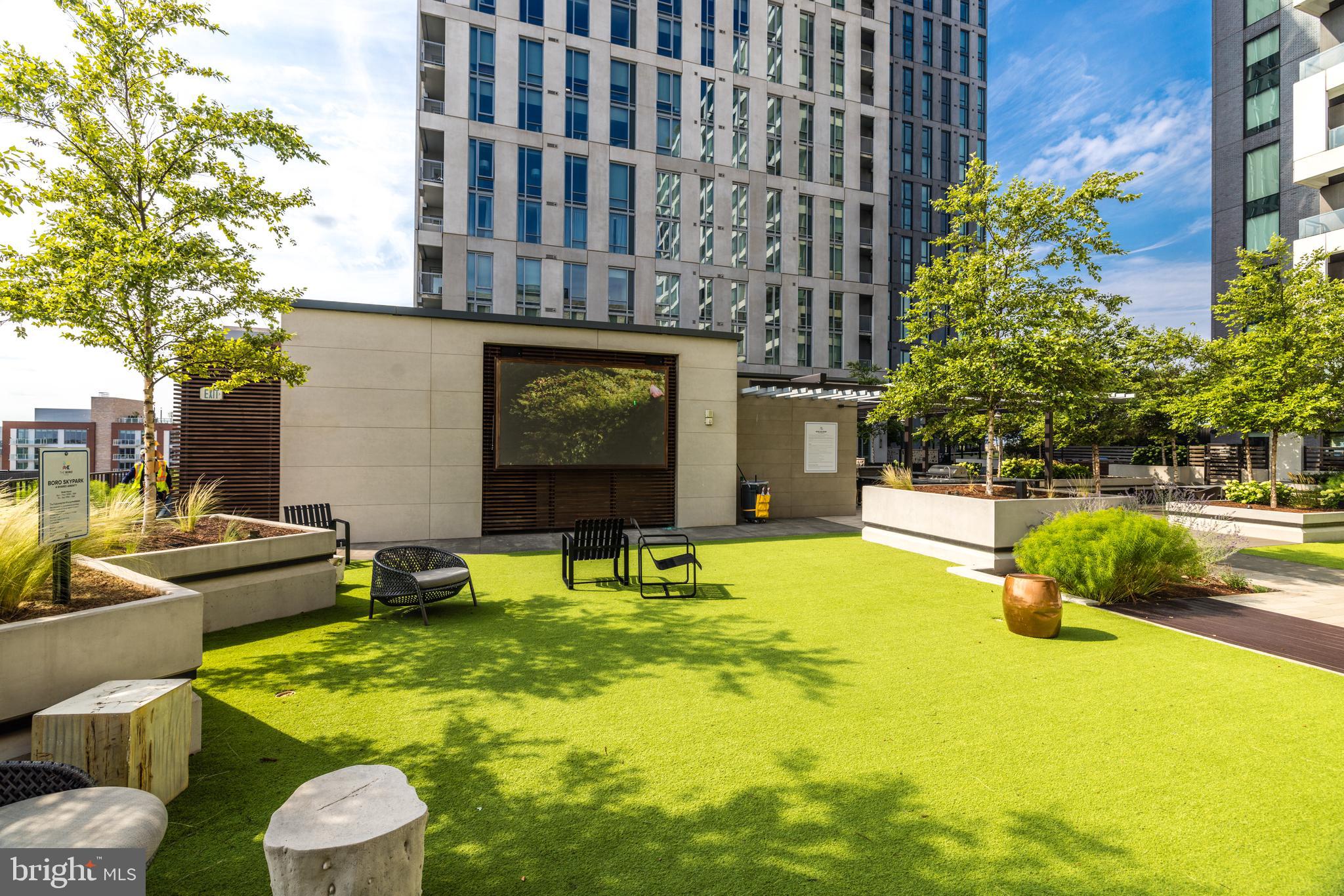 1650 Silver Hill Drive, Unit 23091 McLean, VA 22102 - Photo 66 of 86 a swimming pool with some potted plants and large trees