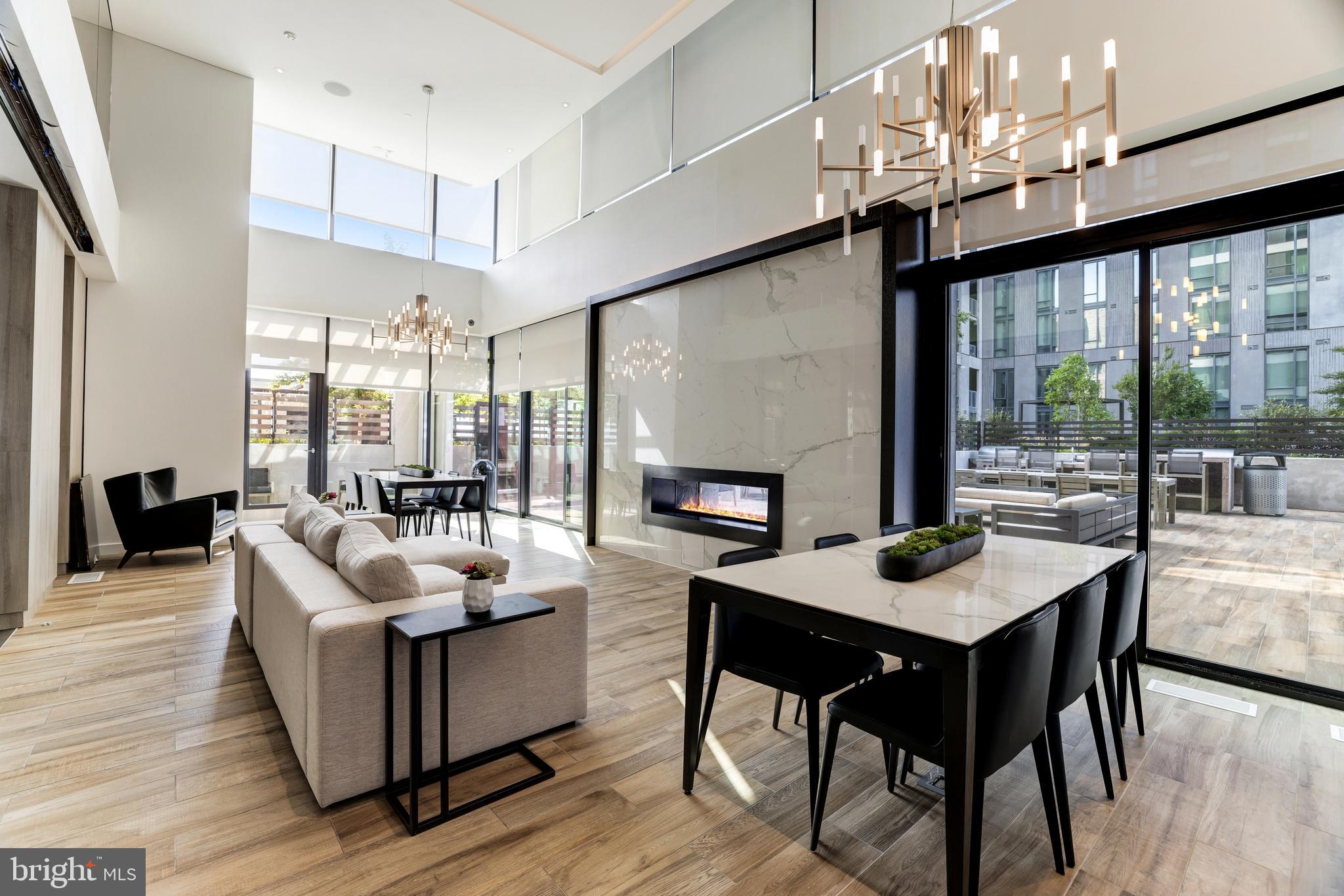 1650 Silver Hill Drive, Unit 23091 McLean, VA 22102 - Photo 70 of 86 a living room with couches a dining table and chairs with wooden floor