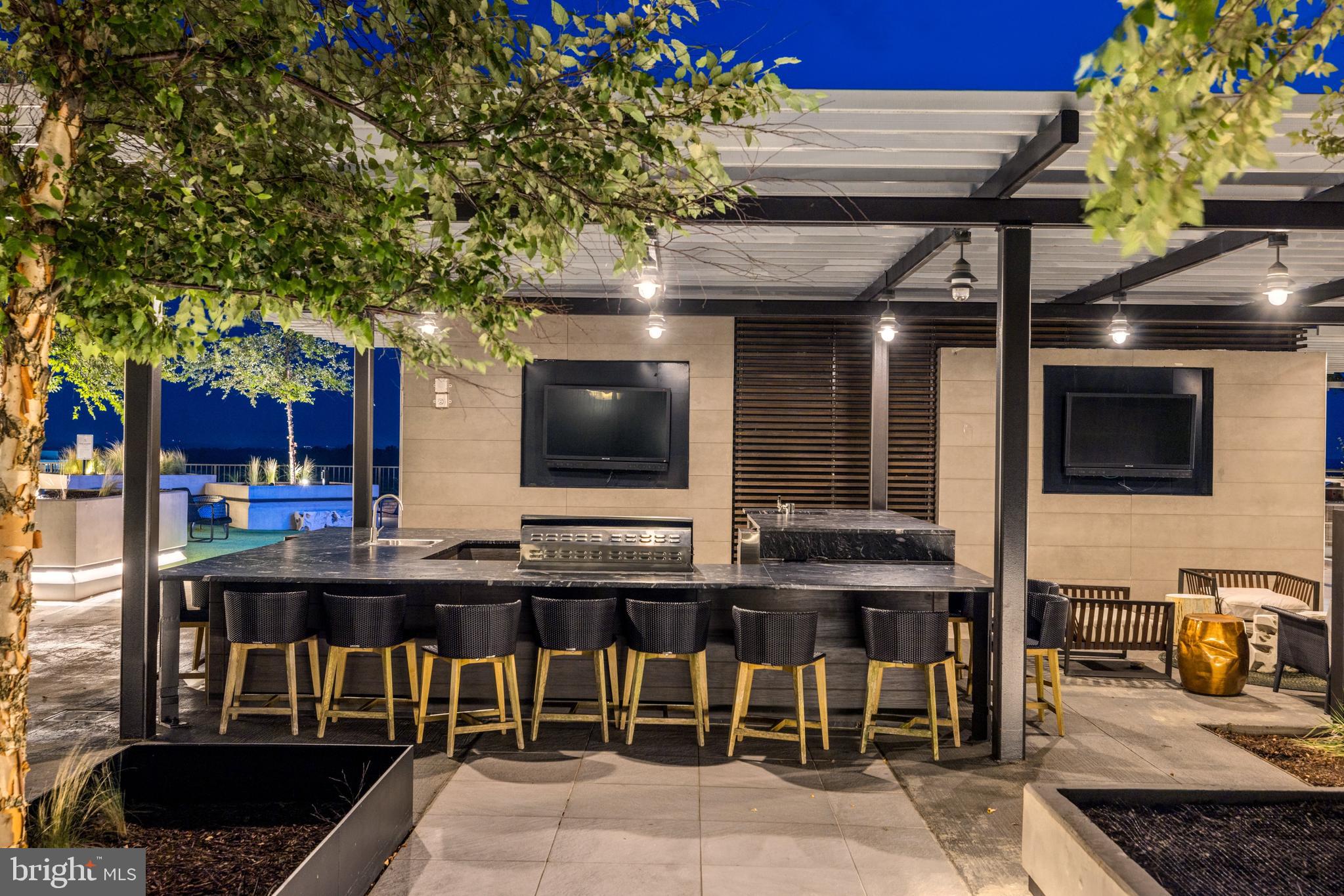 1650 Silver Hill Drive, Unit 23091 McLean, VA 22102 - Photo 78 of 86 a view of a chairs and table in a patio