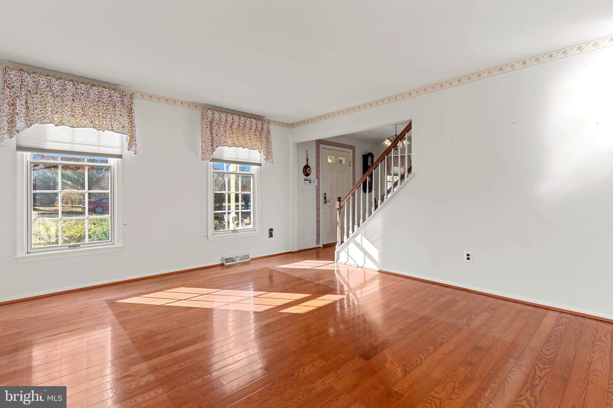 110 Teal Drive Doylestown, PA 18901 - Photo 4 of 30 a view of an empty room with wooden floor and a window