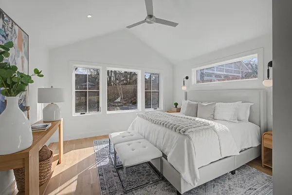 a bedroom with a bed and a chair