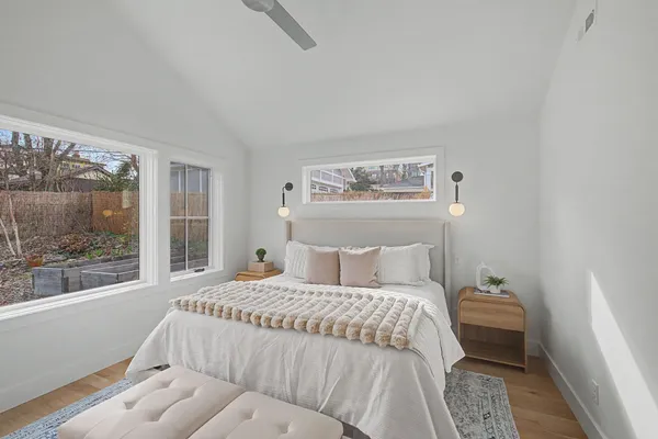 a bedroom with a bed and a window