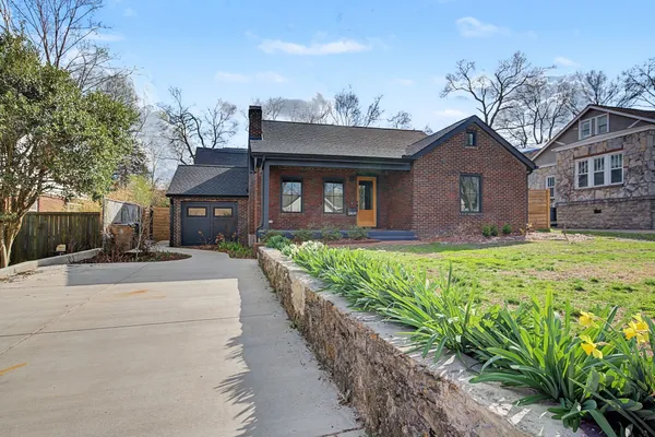 a front view of a house with garden
