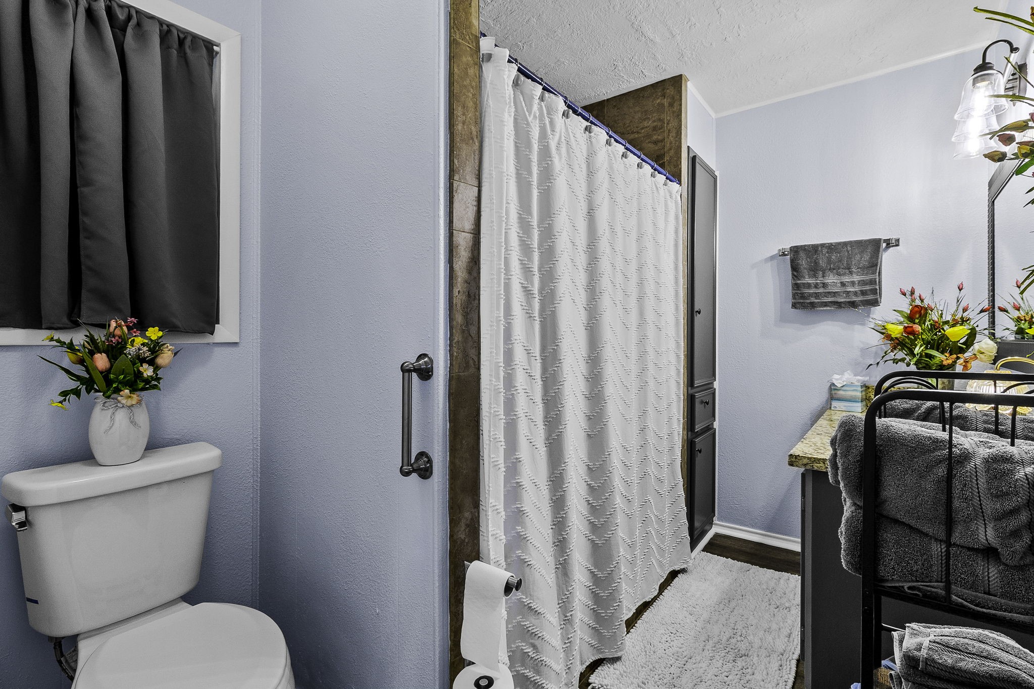 188 Huckleberry Road Onalaska, TX 77360 - Photo 14 of 49 a bathroom with a toilet a sink and mirror