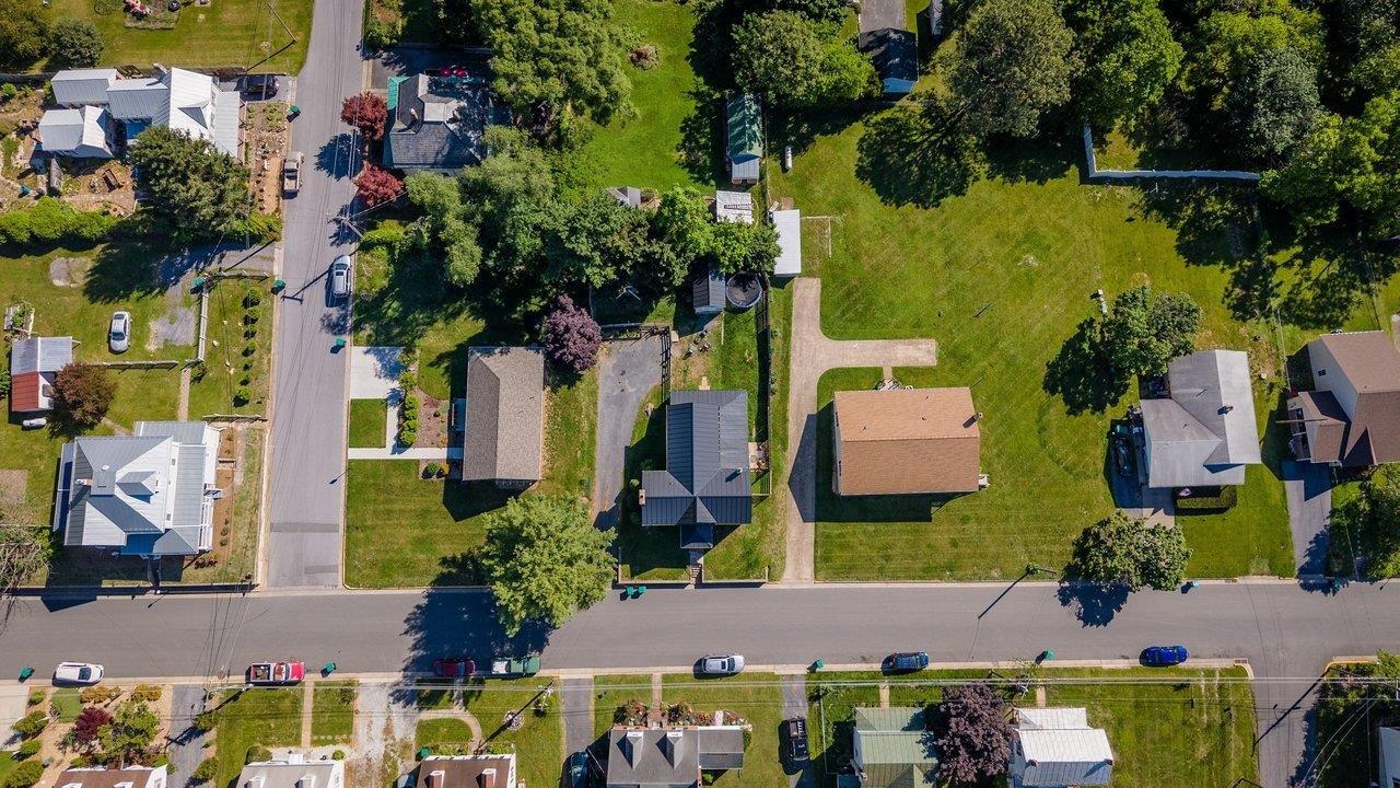 420 West Spring Street Woodstock, VA 22664 - Photo 2 of 67 an aerial view of multiple houses with yard