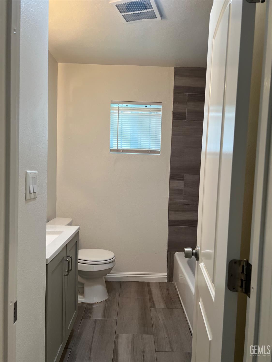 Undisclosed Address Bakersfield, CA 93304 - Photo 11 of 22 a bathroom with a toilet and a sink