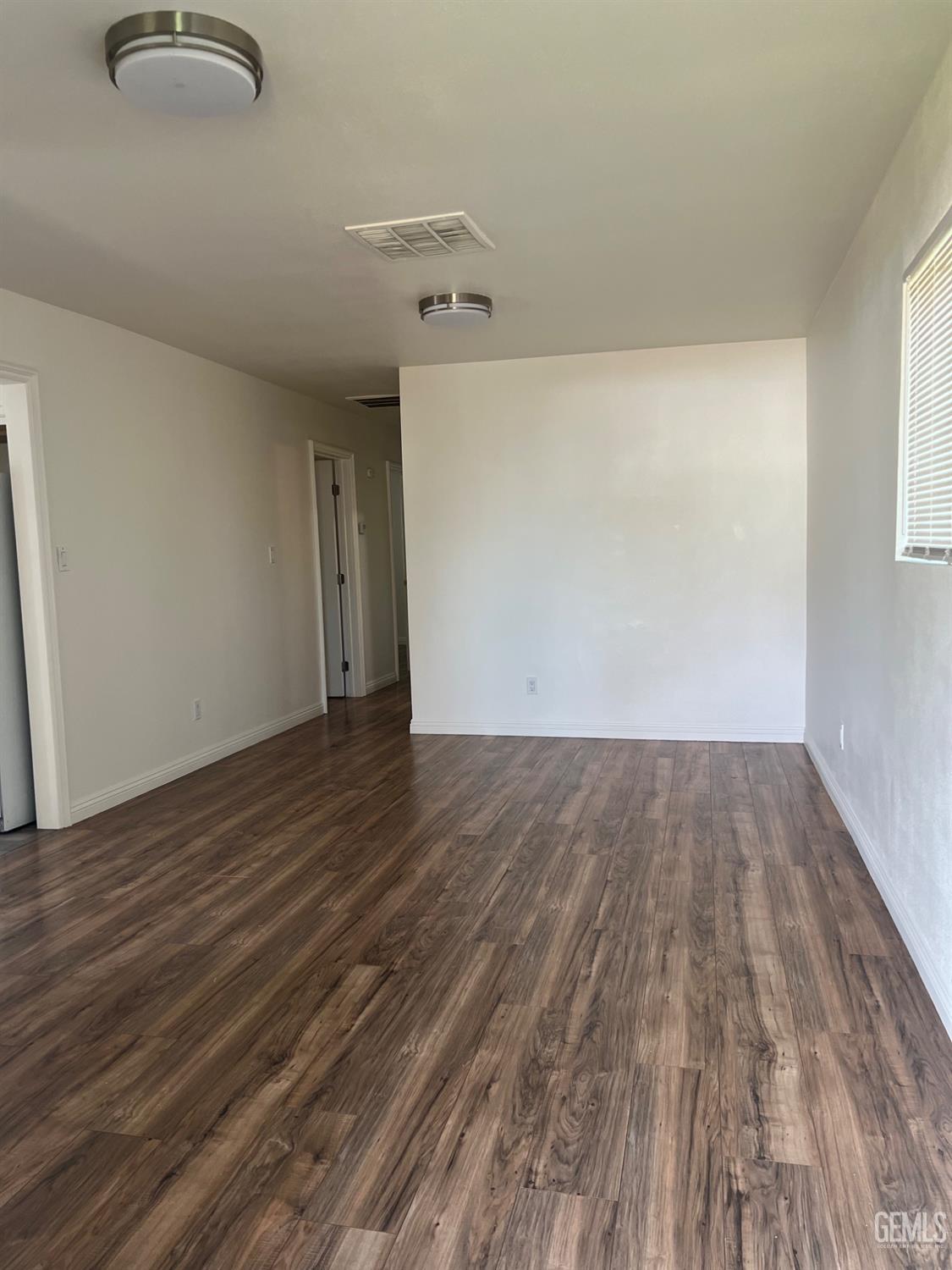 Undisclosed Address Bakersfield, CA 93304 - Photo 6 of 22 a view of a room with wooden floor