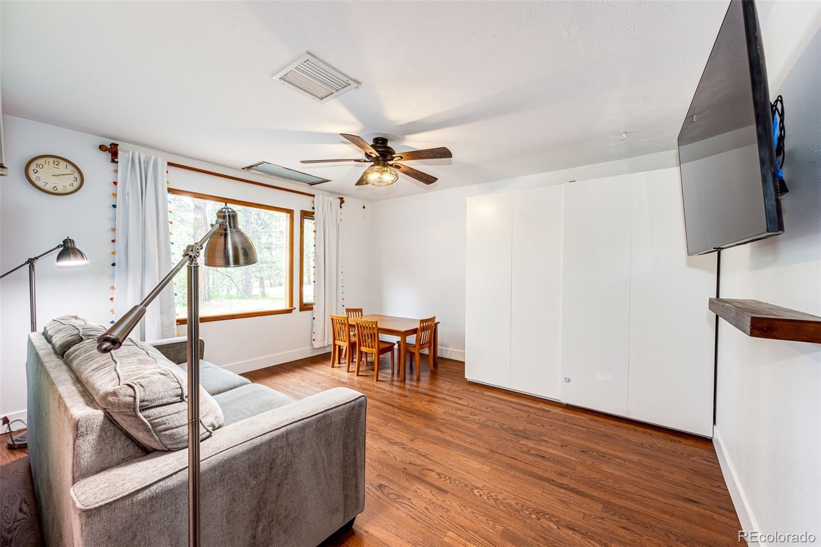 8788 East Tanglewood Road Franktown, CO 80116 - Photo 16 of 48 a living room with furniture and a window