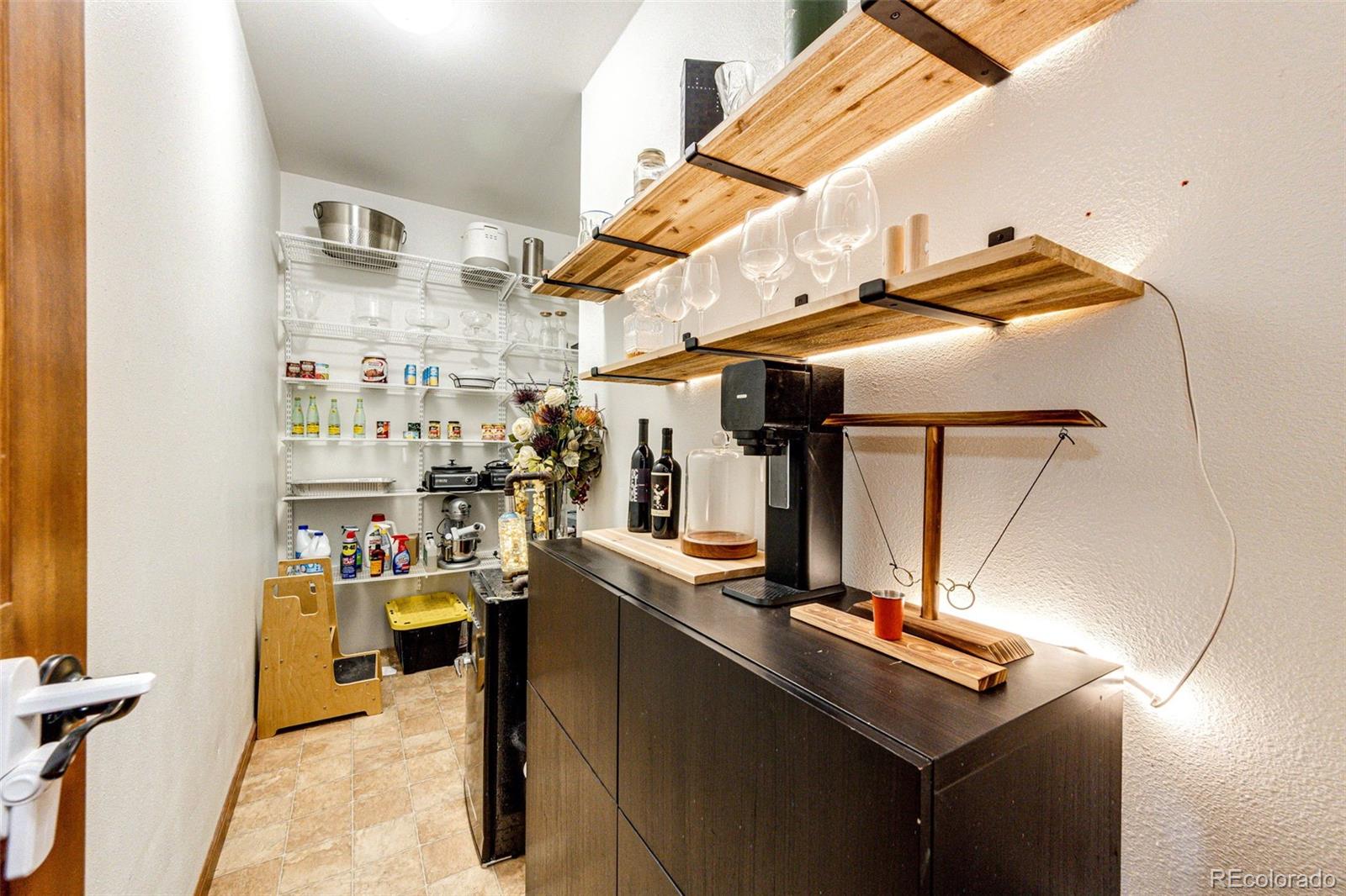 8788 East Tanglewood Road Franktown, CO 80116 - Photo 18 of 48 a view of storage and utility room