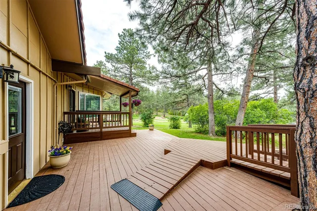 a view of a two chairs in the balcony