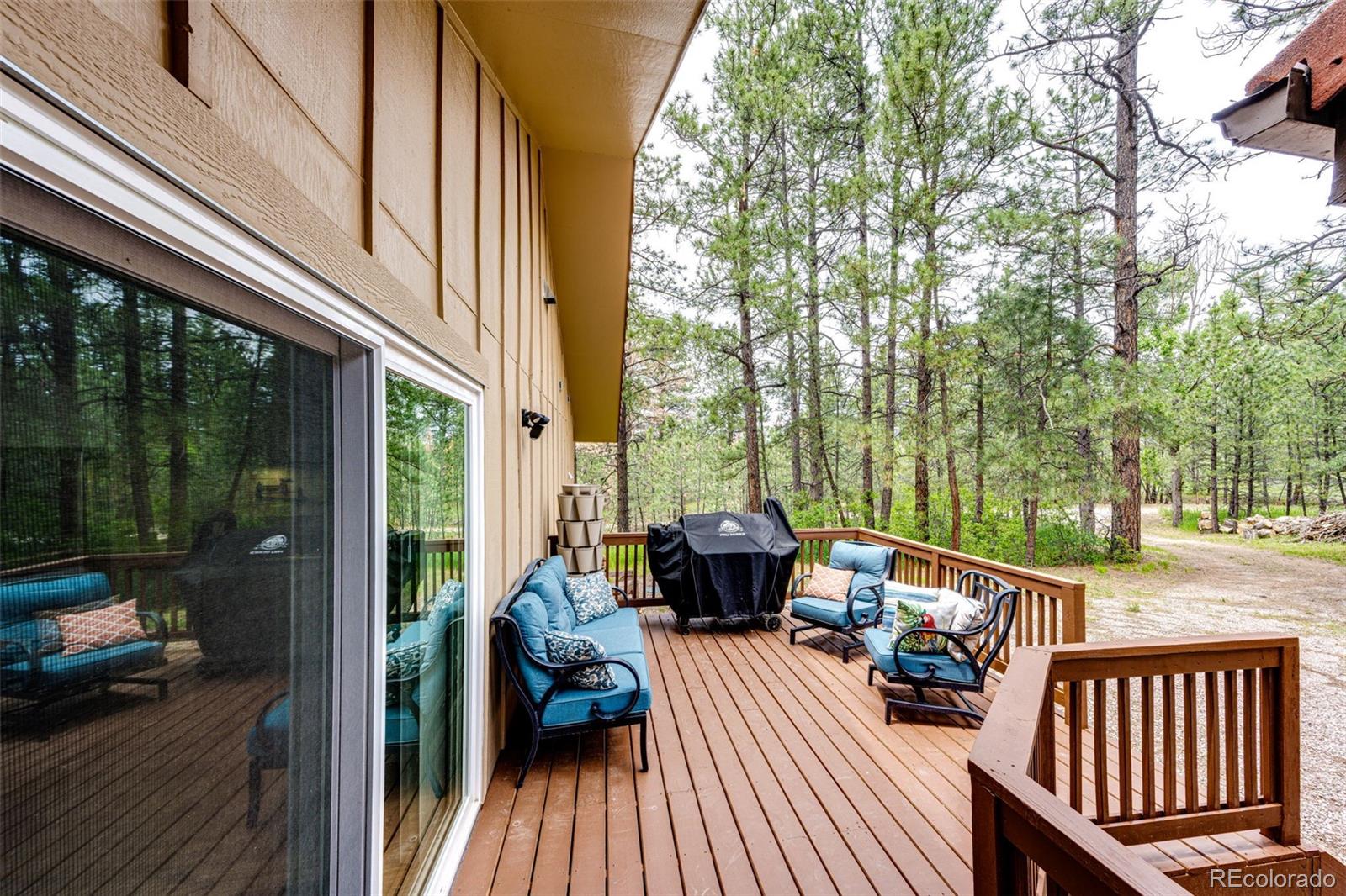 8788 East Tanglewood Road Franktown, CO 80116 - Photo 28 of 48 a view of a two chairs in the balcony