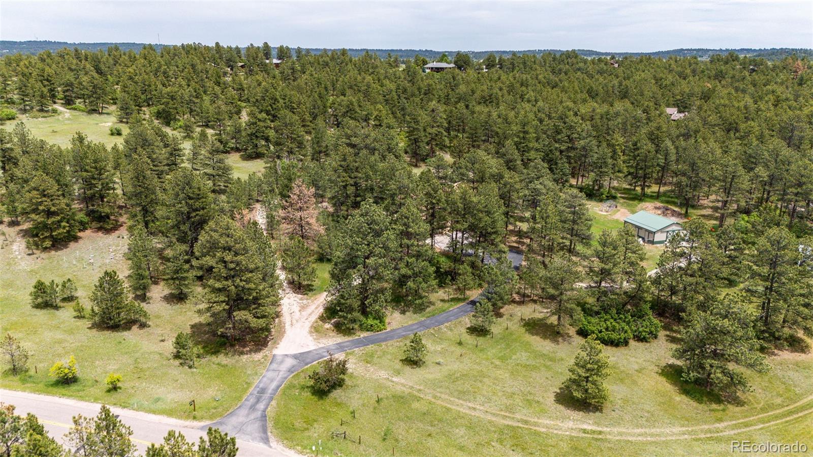 8788 East Tanglewood Road Franktown, CO 80116 - Photo 45 of 48 a view of a lake view