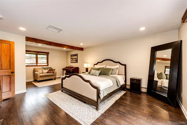 a bedroom with a bed and a couch