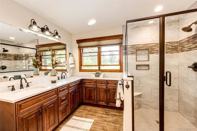 a large kitchen with a large window and stainless steel appliances