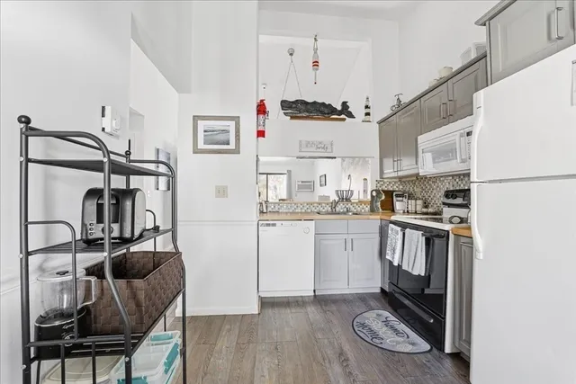 a bathroom with a toilet and a window