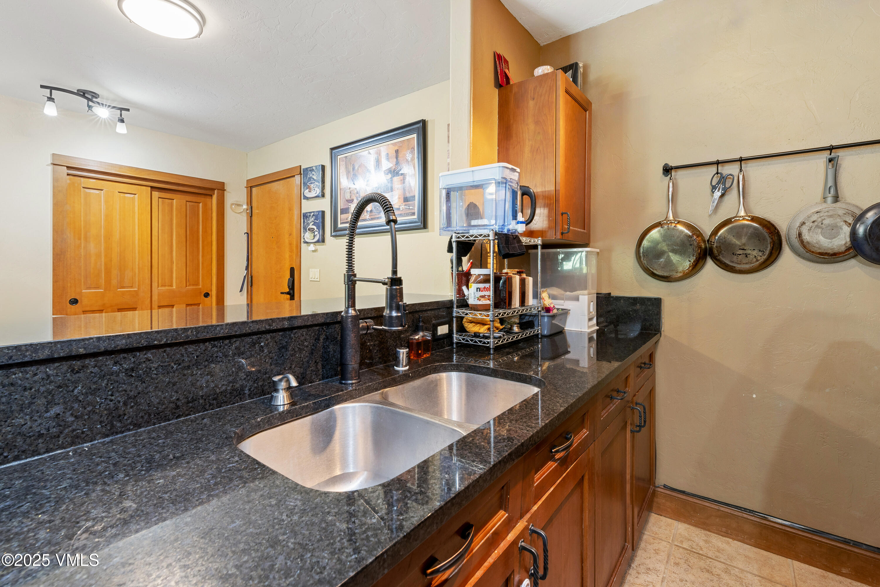 22787 Highway 6, Unit 207 Dillon, CO 80435 - Photo 13 of 44 a bathroom with a sink and a mirror
