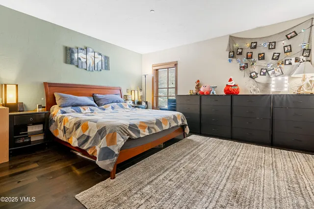 a bedroom with a bed and dresser